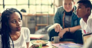 Teenagers drink tea and chat